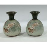 A pair of Lovatts Langley mill pottery vases, painted with naturalistic flowers on a pale green