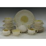 A Belleek porcelain part tea service, comprising teapot, milk jug, sugar bowl, six cups, five