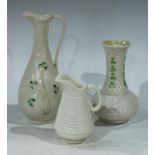 A Belleek Shamrock pattern jug; a Belleek Shamrock pattern vase and a small Belleek jug (3)