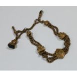 A 19th century 9ct gold fancy link bracelet, with t-bar and hardstone fob, marked 9ct, 20.5g