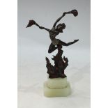 In the manner of Lorenzl, a dark patinated and cold painted bronze, of an Art Deco style dancer,