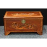 A carved camphor wood chest, 48cm high, 93cm wide.