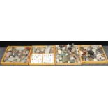 Geology - a collection of polished stones and specimens in three rectangular wooden trays, mostly