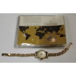A lady's 9ct gold Omega wristwatch with 9ct strap
