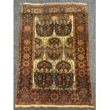 An Antique Tabriz style rectangular rug, with central multi coloured floral stripped panel, cream