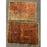 Rugs - a near pair of small antique Persian Prayer rugs, each with a central floral panel with red