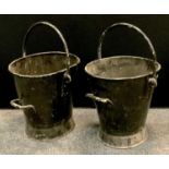 A pair of WWII period painted black fire buckets