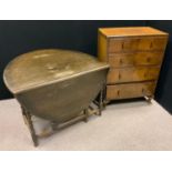 A mid 20th century walnut chest of four drawers, c.1930; an oak oval drop leaf table, barley twist