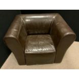 A contemporary brown faux leather arm chair