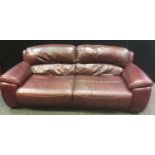 A Violino three seat sofa upholstered in oxblood leather, 85cm high x 216cm wide x 100cm deep.