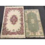 A large contemporary floral rug, cream ground, approx 200cm x 130cm, another smaller green (2)