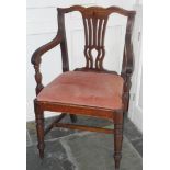 A 19th century mahogany elbow chair, pierced vasular splat, drop-in seat, ring turned legs, c.1820