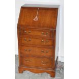 A mid 20th century walnut bureau, fall front with four cockbeaded drawers, bracket feet, 98cm