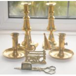 A pair of brass ejector candlesticks, 20cm high, mid 19th century; a pair of brass chambersticks,