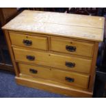 A stainwood chest of two short drawers over two long, plinth base.