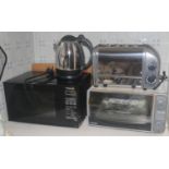 A Dualit four slice toaster; a Panasonic microwave; De'longhi grill; etc