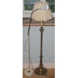 A brass side lamp, 130cm high; a reading lamp; a brass table lamp (3)