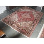 A Middle Eastern woollen carpet, with central medallion and stylised scrolls, 208cm x 157cm.