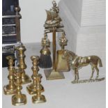 A pair of brass ejector candlesticks; others, a brass two piece companion set; etc