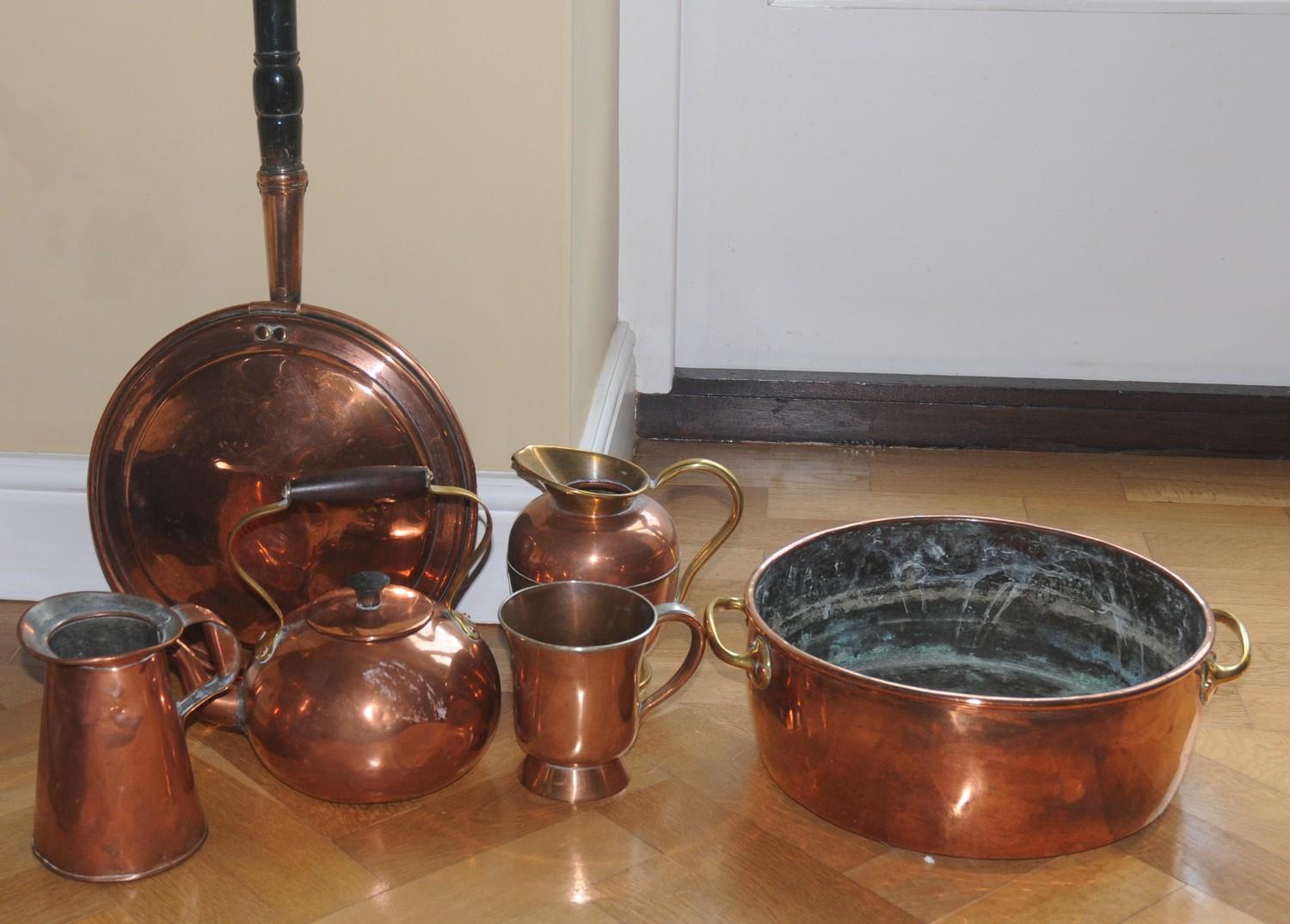 A 19th century copper roll top two handled pan, 51cm diam, c.1850; a copper warming pan; etc