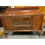 A 1930/40's mahogany sideboard, galleried back, three drawers flanked by cupboards, cabriole legs,