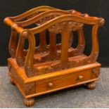 A Victorian style mahogany two section Canterbury, pierced and carved cresting rails, turned