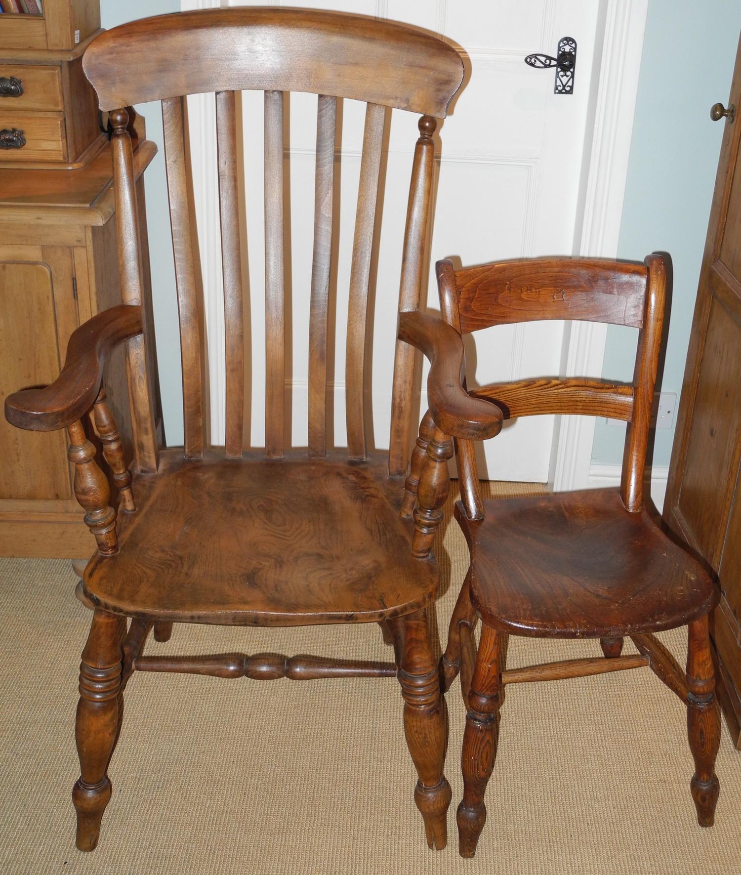 A 20th century beech kitchen elbow chair, slat back, turned legs; an elm kitchen side chair (2)