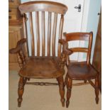 A 20th century beech kitchen elbow chair, slat back, turned legs; an elm kitchen side chair (2)
