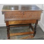 An 18th century oak bible box, hinged cover, carved with lunettes, 18cm high, 70cm wide, 40cm