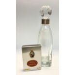 An Asprey decanter with white coloured metal mount; Romeo and Julieta Hazana cigars in metal case