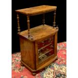 A Victorian bowfront walnut music cabinet, shelf with turned supports to superstructure, glazed door