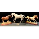 A Border Fine arts model Clydedale Stallion, A0732; a Beswick model Spirit of Youth etc (3)