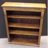 An oak floor standing bookcase. 107cm high x 91.5cm wide x 27.5cm deep.