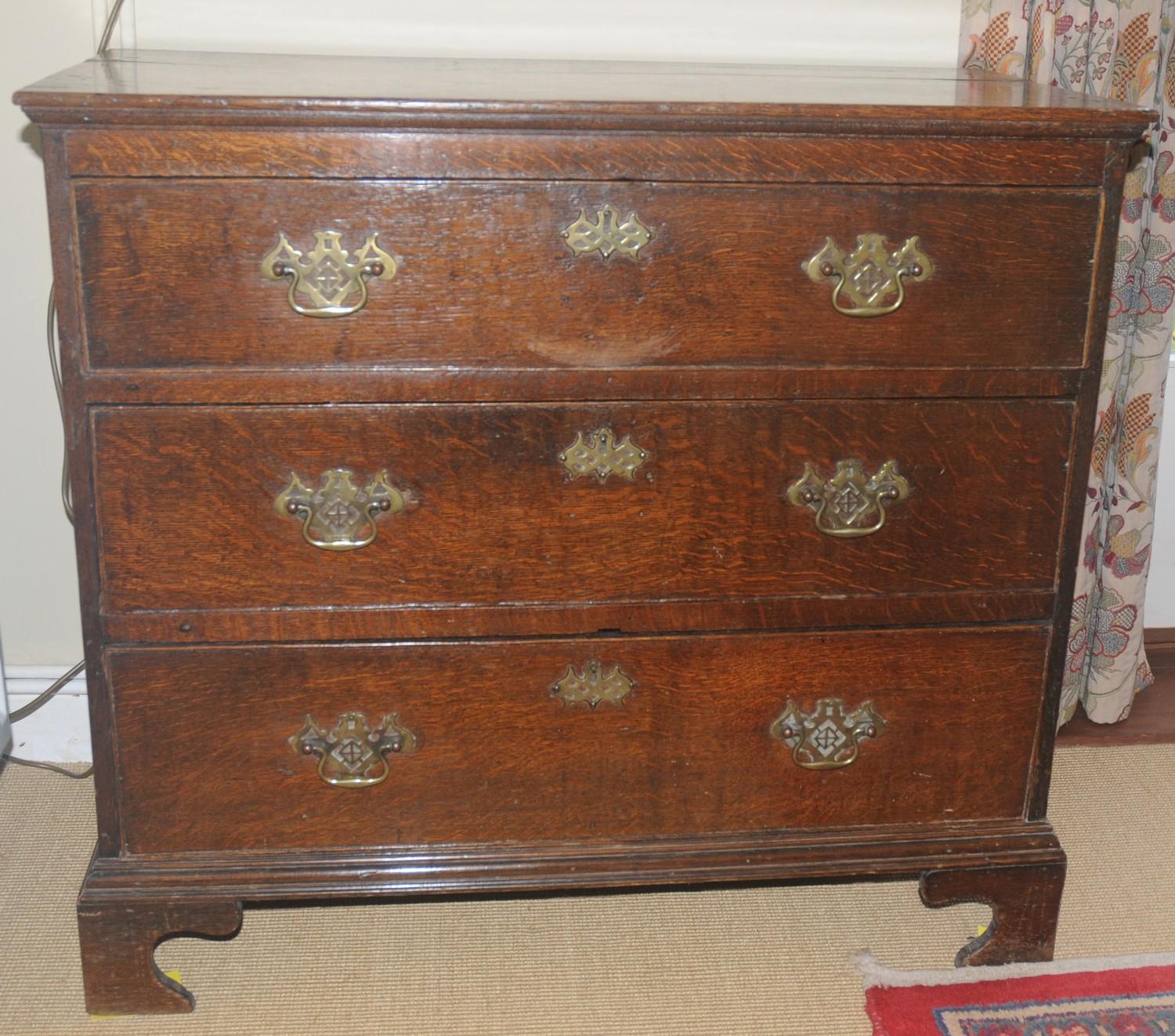 An 18th century oak chest, of three long drawers, pierced batwing handles and escutcheons, 80cm - Image 2 of 2