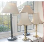 A pair of contemporary side lights, black columns, cream shades; a pair of brass side lights