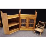 A pine wall mounted corner unit and lead glazed wall cabinet; an elm child?s chair (3)