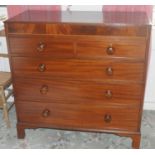 A 19th century mahogany chest, of two short and three long graduated cockbeaded drawers, turned