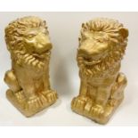 Architectural salvage - a pair of reconstituted stone garden lions, modelled seated, 39cm high (2)