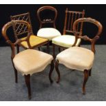 A pair of Victorian balloon back chairs, carved top rail and horizontal splat, stuffed overseat,