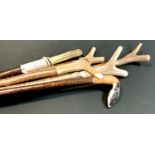 Walking Sticks - A carved Badger head walking stick, others including thumb sticks, antler