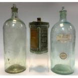 Tools - a vintage Exide GFG4 glass cased battery; two apothecary clear glass bottles (3)