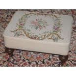 A 20th century rectangular foot stool, tapestry top, turned legs, 58cm wide, 30cm high