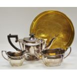 A Victorian silver plated three piece tea set; an oriental brass tray (4)