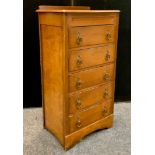 A gentleman`s five drawer dressing chest, hinged top opening to mirror and storage, 113cm high x