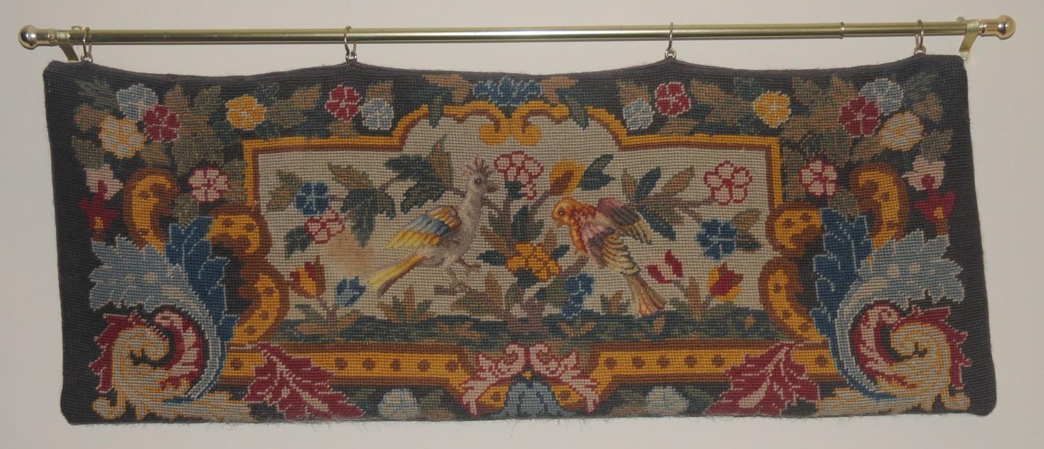 A Victorian woolwork tapestry, embroidered with birds, 70cm wide, 33cm high, c.1870