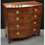 A Regency style bow front mahogany chest, crossbanded top, two short cockbeaded drawers over three