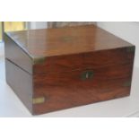 A Victorian brass bound mahogany folding writing box, brass shield escutcheon, the interior with