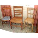 A 19th century beech side chair, solid seat, c.1850; an Edwardian bedroom chair; another (3)
