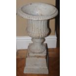 A Victorian cast iron campana shaped urn, egg and dart border, spreading pedestal , 51cm high