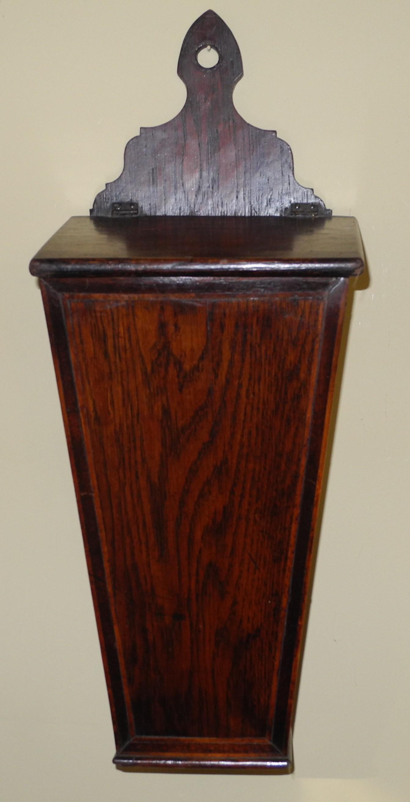 A mid 19th century oak tapering candle box, sloping hinged cover, 51cm high, c.1850